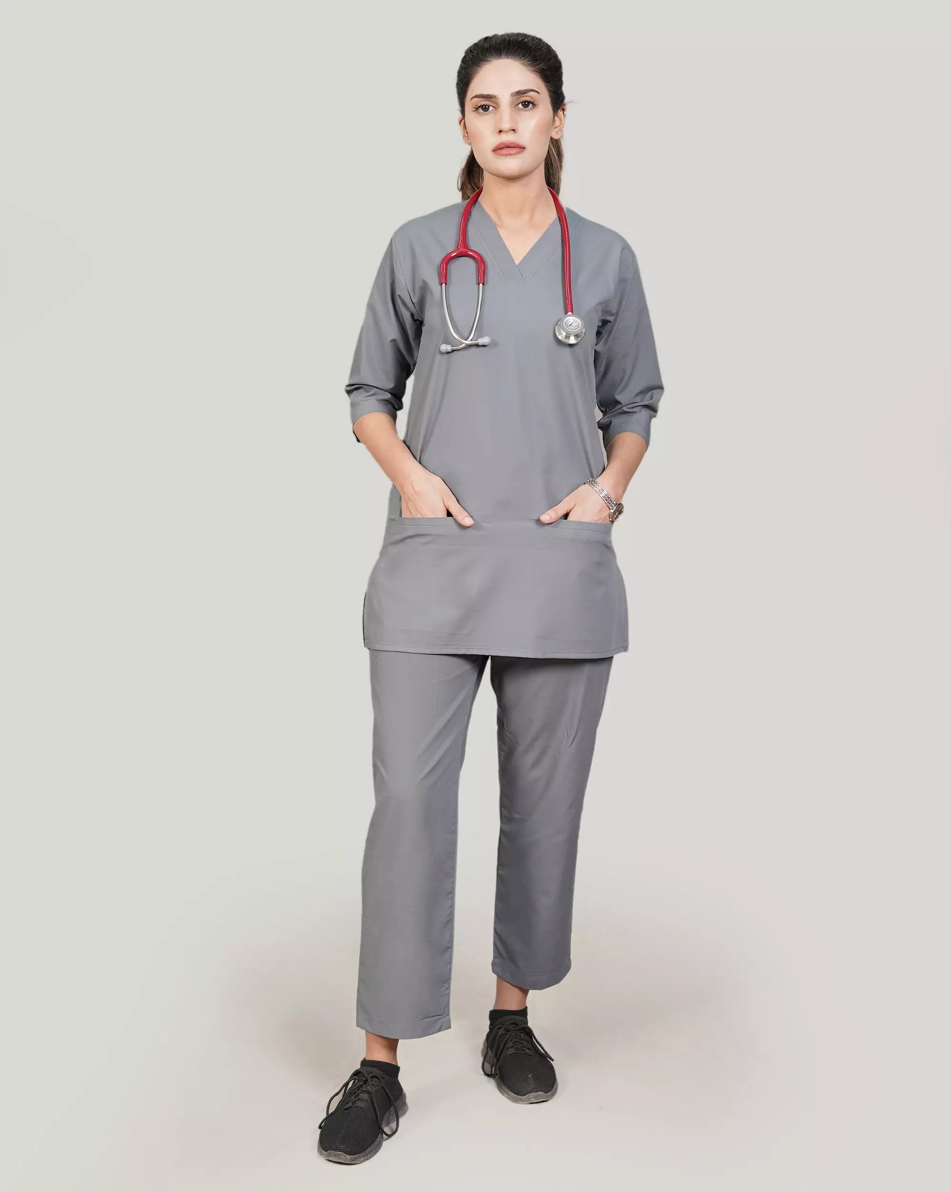 Person wearing gray medical scrubs with a stethoscope.