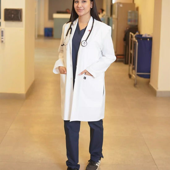 A person of indeterminate gender wearing a white, unisex lab coat with half sleeves and multiple pockets.