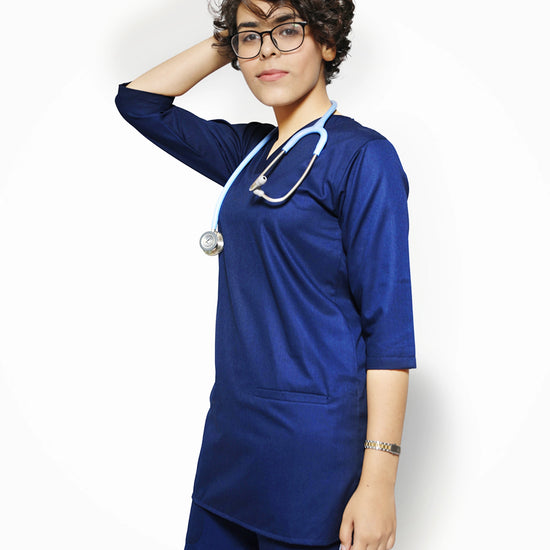 Female wearing a blue doctor scrub set with a stethoscope on a white background