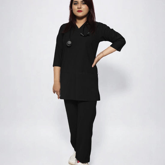 women wearing a black medical scrub outfit on a plain background