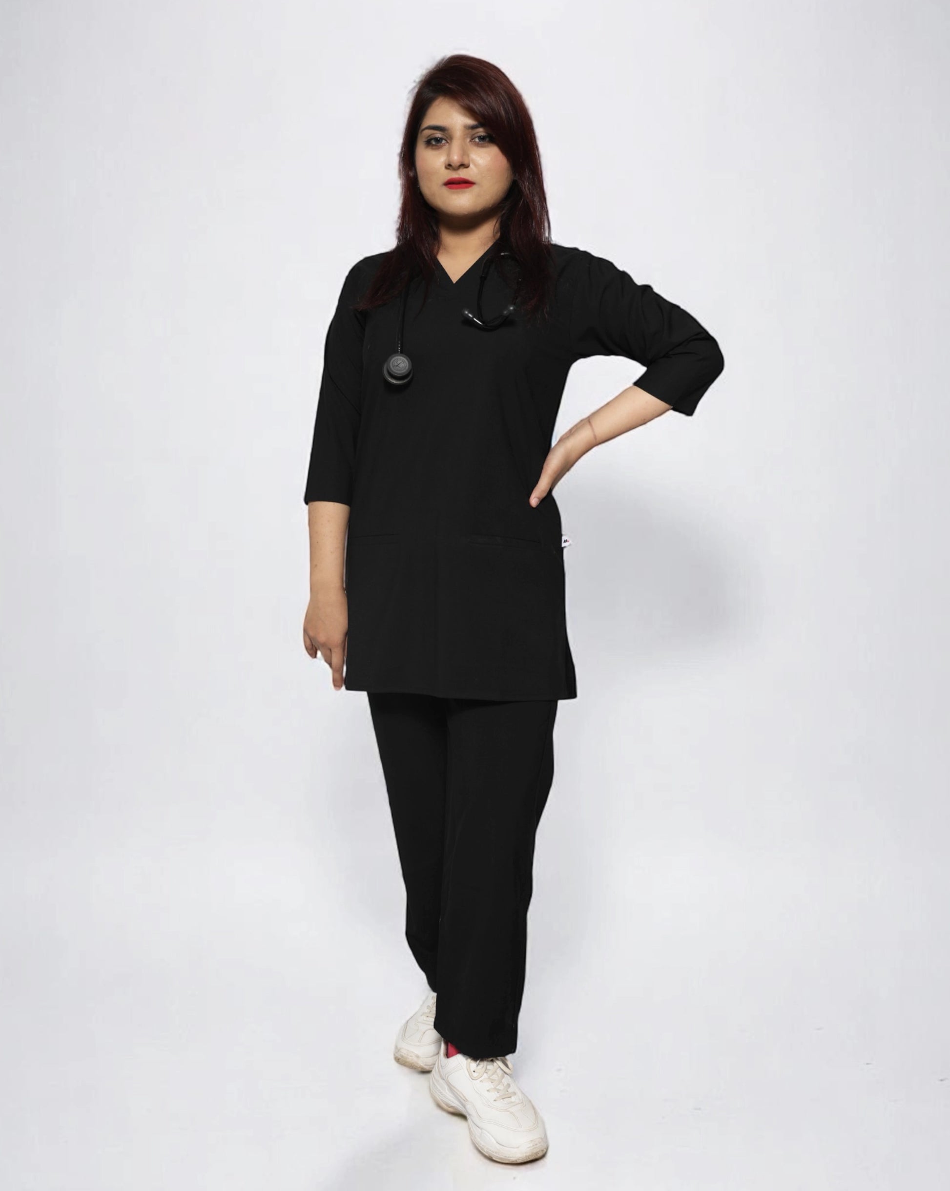 women wearing a black medical scrub outfit on a plain background