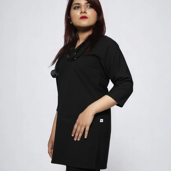 Person wearing a black coat against a white background