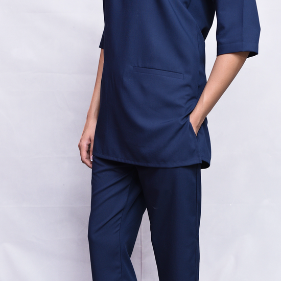 Navy blue scrub set on a white background