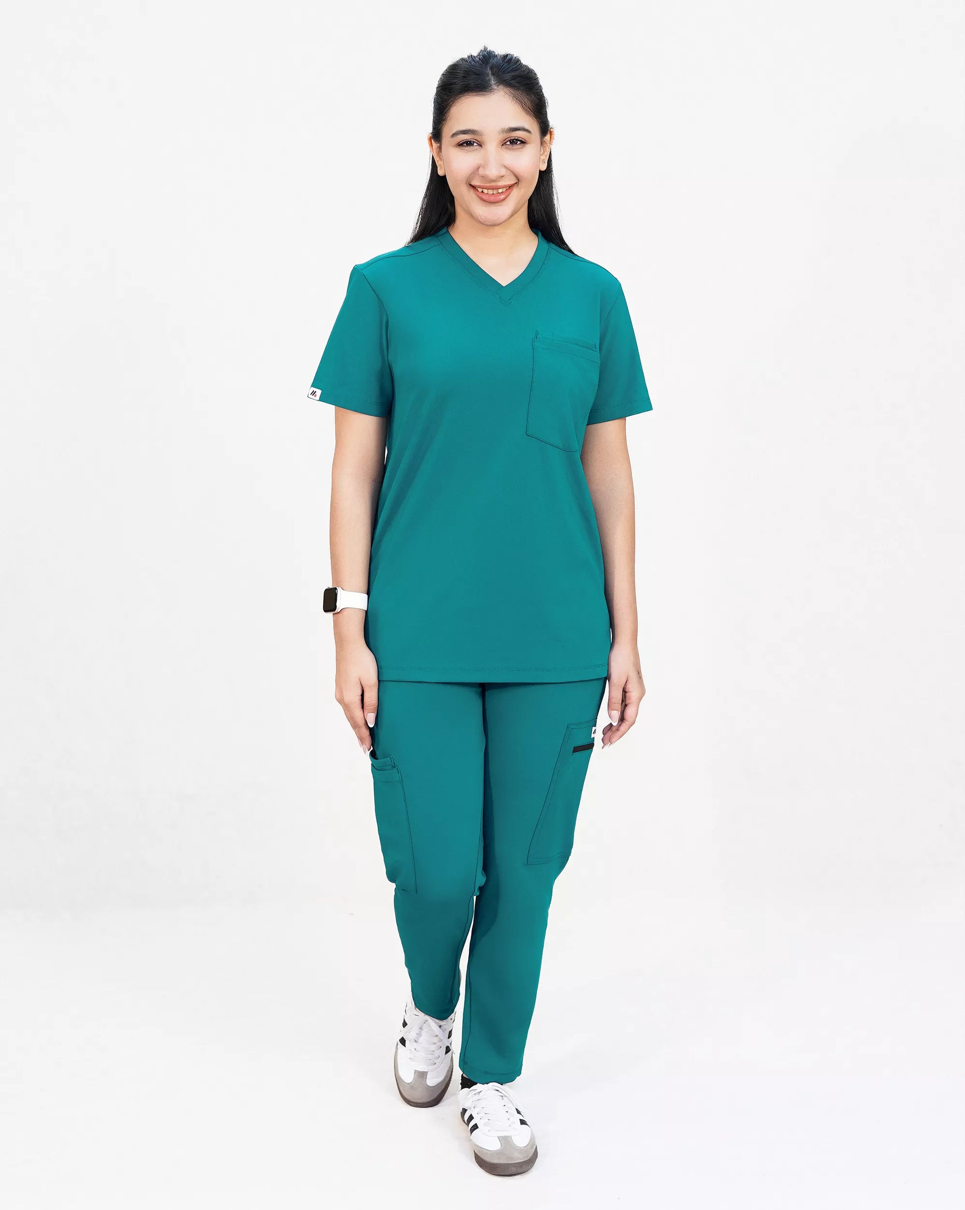 Person wearing a teal Premium Medical Scrubs set on a white background
