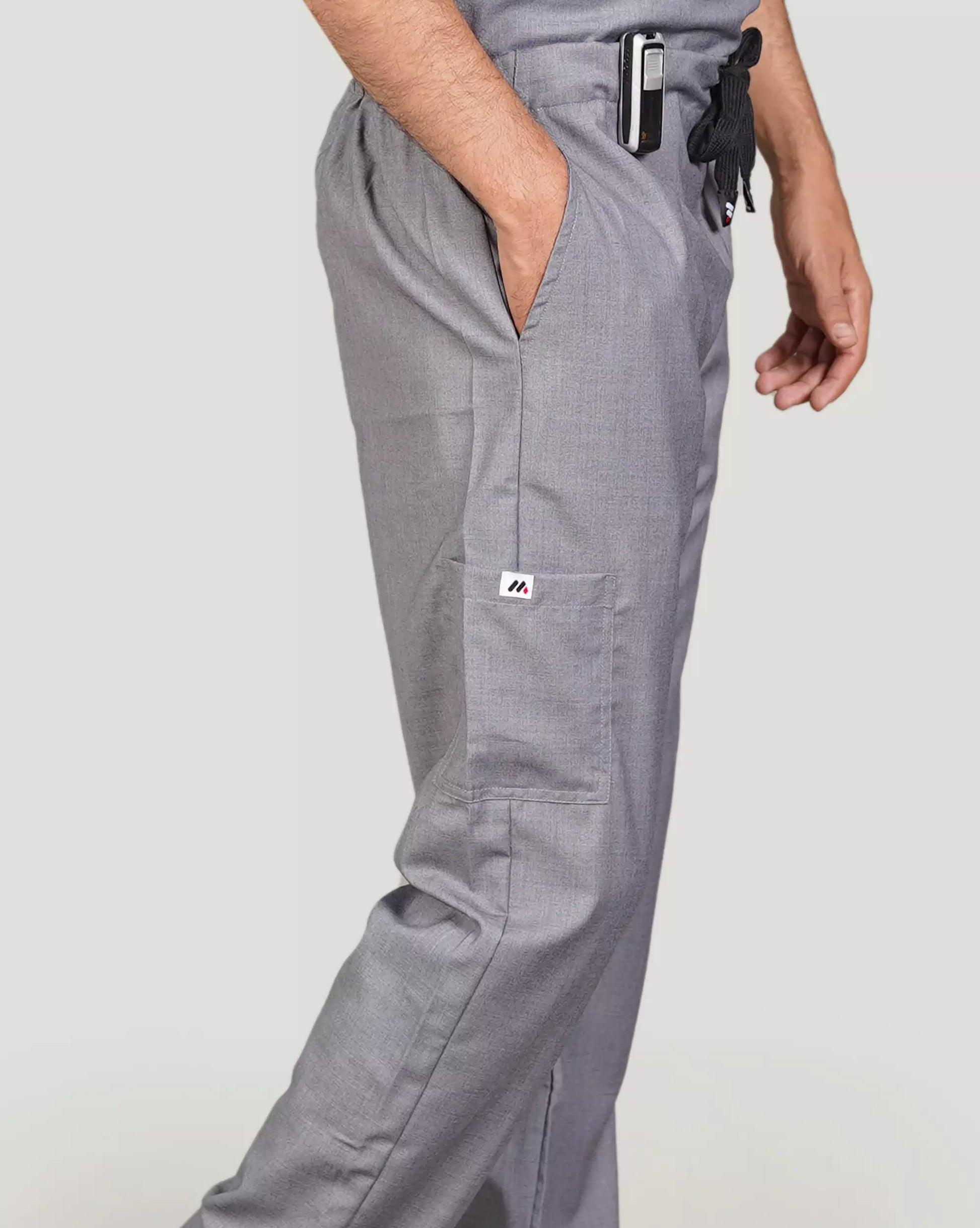 Gray pants worn by a person against a plain background