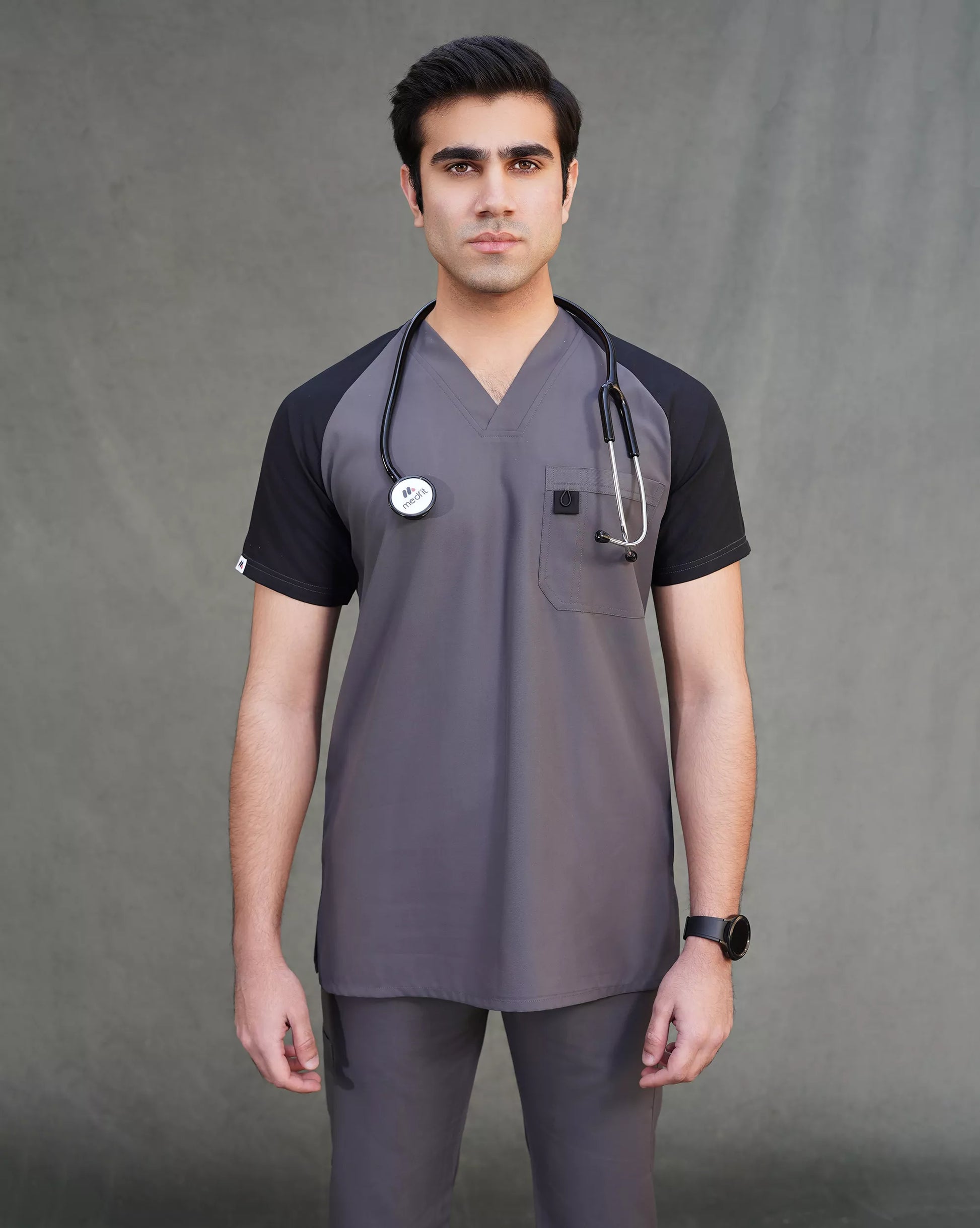 Doctor wearing a gray medical scrub set with a stethoscope.