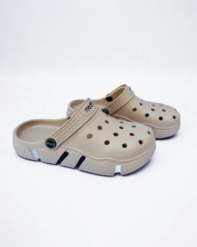 A medical professional clog with white and orange details, featuring a slip-on design with perforations and a closed heel.