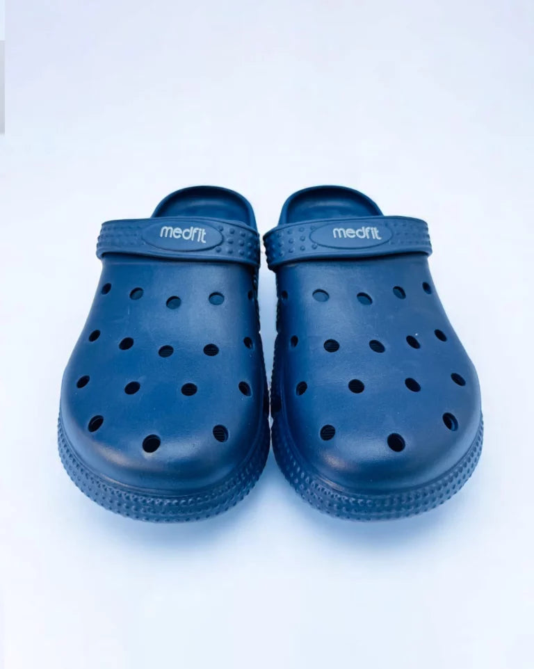 Pair of blue clogs on a white background