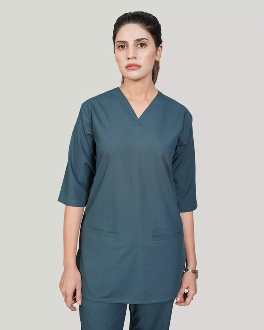 lady doctor wearing a teal scrub set on a plain background