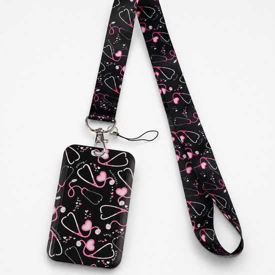 Cute black Care Beat neck lanyard and matching ID badge holder with a pink stethoscope and hearts pattern, by MedFit.