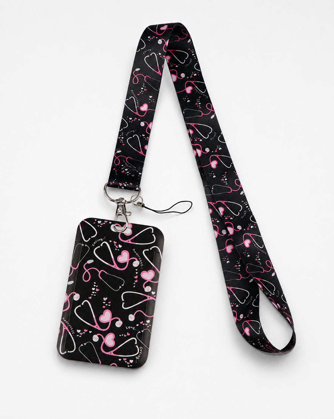 Cute black Care Beat neck lanyard and matching ID badge holder with a pink stethoscope and hearts pattern, by MedFit.