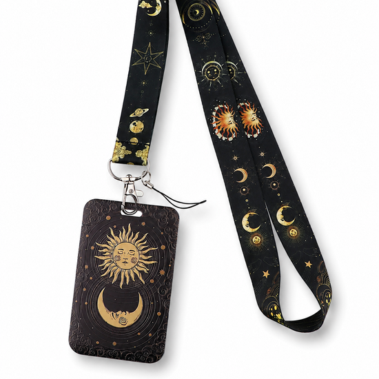 Mystical black neck lanyard and matching ID badge holder with a gold celestial sun, moon, and stars pattern by MedFit.