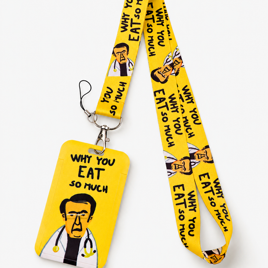 Funny yellow neck lanyard and matching ID badge holder featuring a Dr. Now cartoon illustration and 'Why You Eat So Much' text, by MedFit.