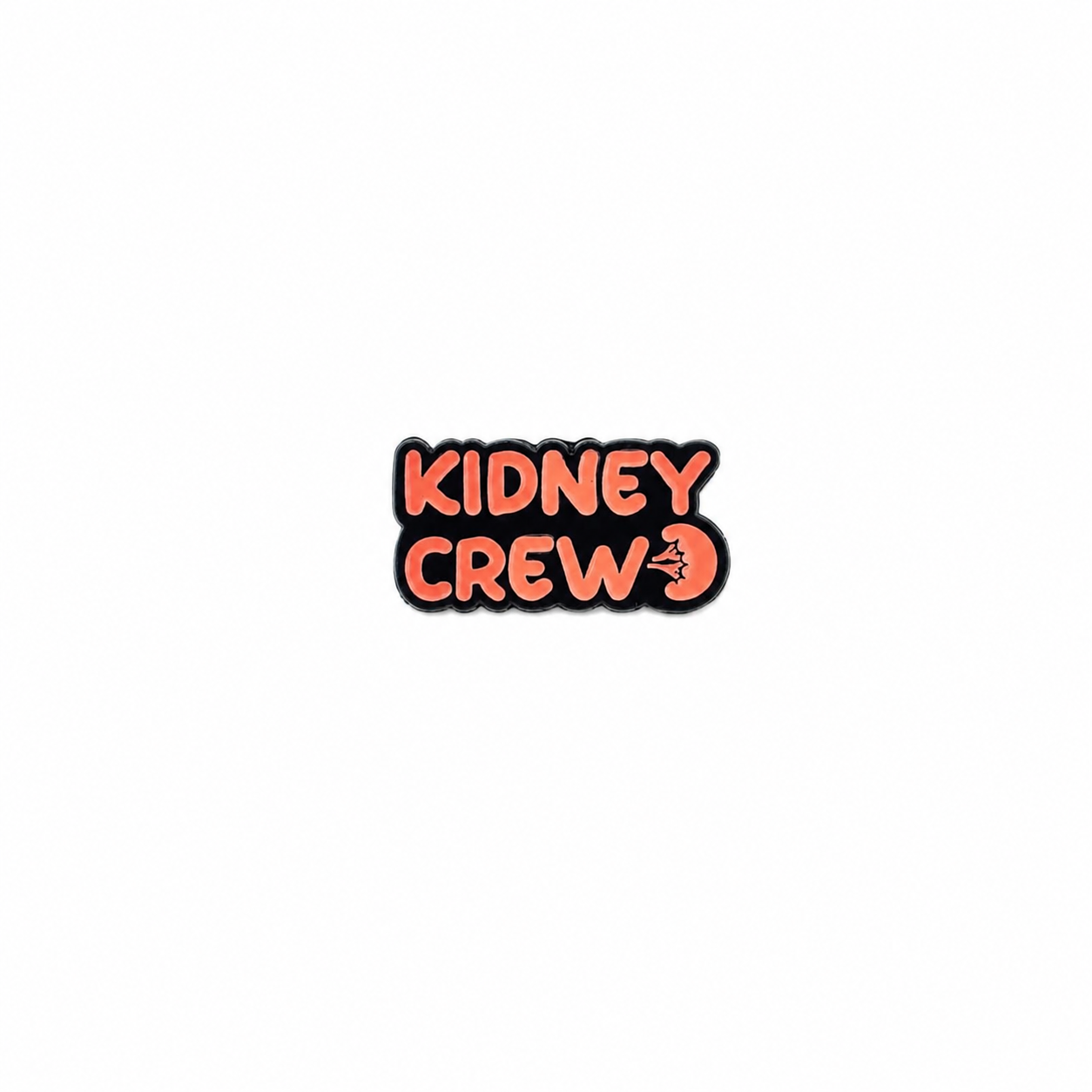 An enamel lapel pin featuring the text "KIDNEY CREW" in bold orange lettering with a small anatomical kidney graphic against a white background.