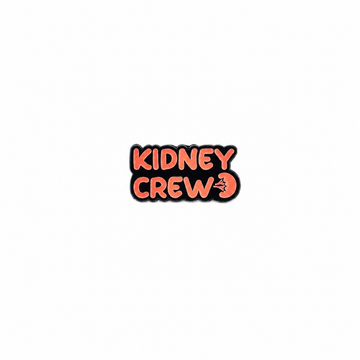 An enamel lapel pin featuring the text "KIDNEY CREW" in bold orange lettering with a small anatomical kidney graphic against a white background.