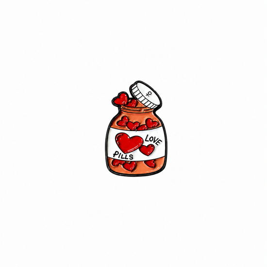 An orange medicine bottle enamel lapel pin filled with heart shapes and labeled "LOVE PILLS" against a white background.