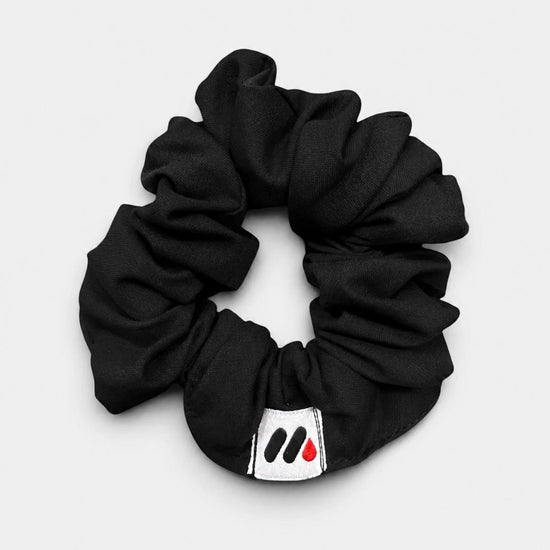 MedFit black fabric hair scrunchie with logo tag for nurses and healthcare workers.