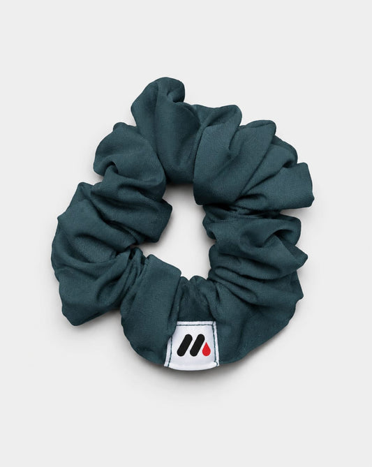 MedFit emerald green fabric hair scrunchie with logo tag for nurses and healthcare workers.