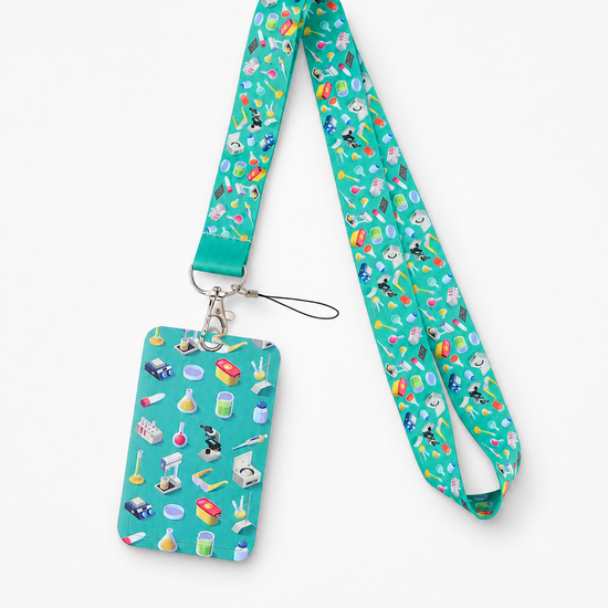 Teal neck lanyard and matching ID card holder featuring a colorful laboratory science gear pattern with microscopes and beakers, by MedFit.